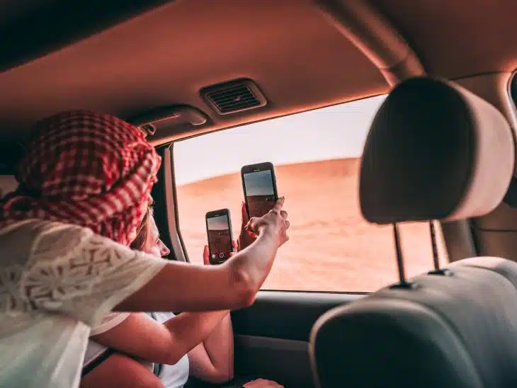 People Taking Photo Of The Desert